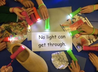 children hands with torches and opaque materias